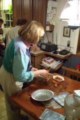 Kathy working at kitchen table