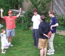 Steve hides the football while passing it to Phil.