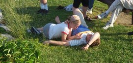 Jocelyn and Steve on the grass by the bench