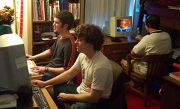 Kevin, Michael, and Trevor sitting at computers in the boys' bedroom.