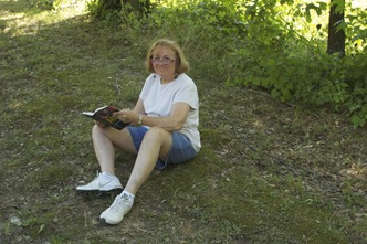 Kathy looking up from book