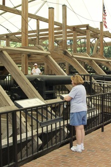 Kathy reading at salvaged gunboat