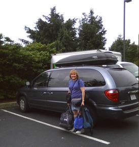 Kathy holding bags in front of Ulysses